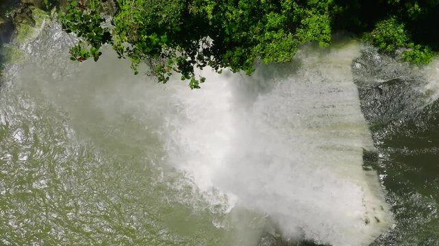 Flying over the water cascade of Hikong Alo Falls in Lake Sebu. Mindanao, Philippines. Slow motion.