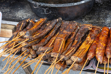 Grilled skewers or shaokao sold on the street in Chongqing, China. S