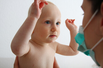 Doctor and Infant Interaction During Child Health Evaluation