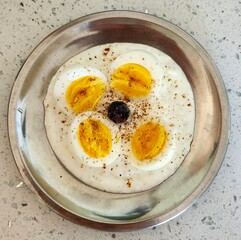 healthy breakfast boiled eggs with blueberry on the yogurt. 