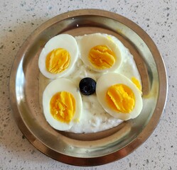 healthy breakfast boiled eggs with blueberry on the yogurt. 