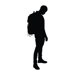 Silhouette of a young man wearing a backpack, standing and looking down in a pensive or contemplative pose. Ideal for themes related to travel, education, loneliness, contemplation, or journey.