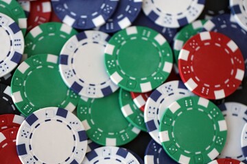 Poker Table With Poker Chips Turns In Casino. Many Poker Chips Spins on the Table