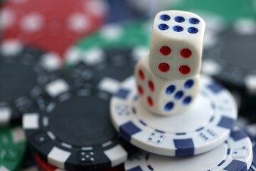 Dice game on the poker table in the casino. A successful combination of dice brought a lot of winning chips
