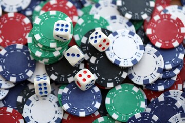 Dice game on the poker table in the casino. A successful combination of dice brought a lot of winning chips