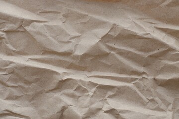 Brown crumpled recycled paper texture background. Kraft Paper