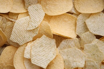Homemade Flavored Paprika Potato Chips in a Bowl, top view. Flat lay