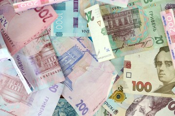 Big amount of different Ukrainian hryvnia money bills. Pile of crumpled ukrainian banknotes