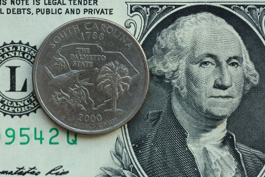 American cent coin on dollar bill close up. United States currency
