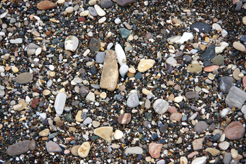 Wet stones and pebbles on the ocean beach