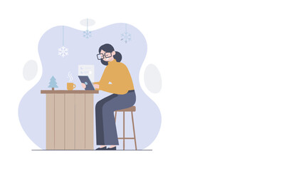 Woman working on a tablet with coffee in a cozy winter environment remote work concept
