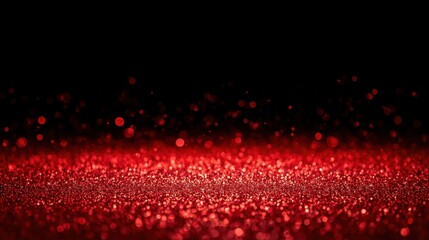 A vibrant red glitter foreground with blurred red bokeh on a dark background.