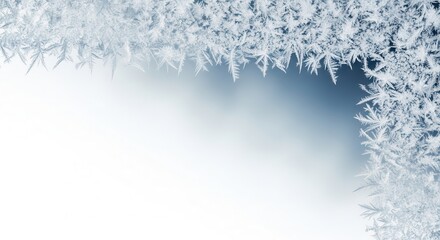 Intricate frost patterns on a window during winter.