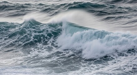 Fototapeta premium The Power of the Ocean: Capturing the raw, untamed beauty of the ocean as a powerful wave crests, its foamy embrace, conveying nature's untamed force and serene allure.