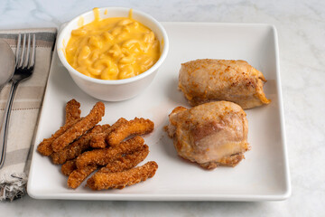 chicken thighs with  mac and cheese  and chicken fries