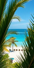 Fototapeta premium Lush palm fronds frame a pristine tropical beach with white sand and sun loungers by the azure sea, white sand, escape