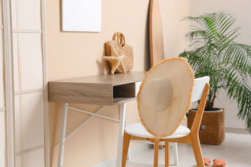 Interior of stylish living room with workspace and summer decor