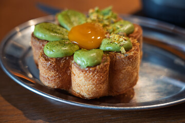 Close-up of delicious flower shaped cronut pastry on metal plate, Vilnius, Lithuania