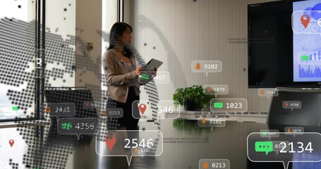 Female biz exec tapping tablet and summoning dotted-globe bubbles over table while reviewing charts - Powered by Adobe