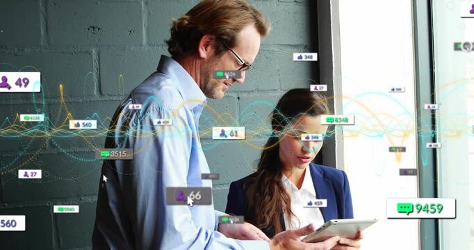Man tapping tablet by window, woman taking tablet as animated metrics rising for business analytics