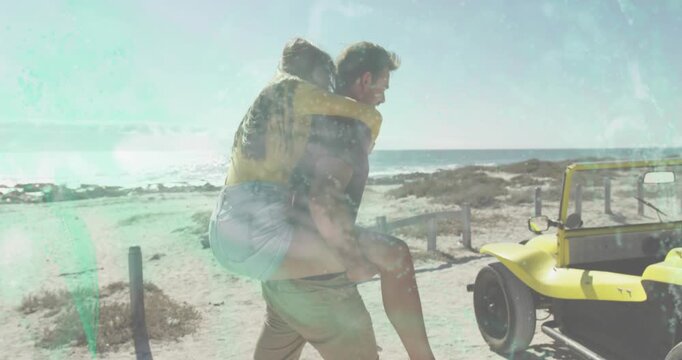 Nearing yellow buggy, man carrying woman piggyback shifting grip and helping her board for travel