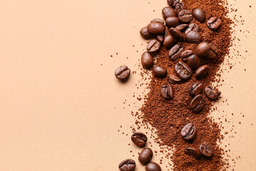 Coffee beans and powder on beige background