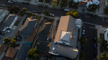 The sun sets on homes and a church in the historic Lincoln Heights neighborhood of Los Angeles,...