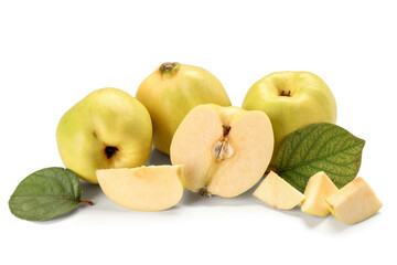 Sweet ripe quinces with cut pieces and leaves on white background
