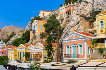 Symi town on Symi island with colorful neoclassical houses, Greece