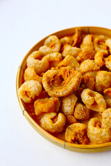 Crispy pork cracklings, a crunchy savory snack.