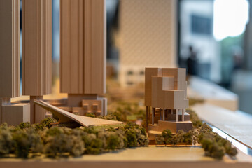 Wooden cityscape architectural model features buildings, waterfront, trees, urban planning concept