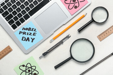 Paper with text NOBEL PRIZE DAY, stationery, drawn molecules and magnifiers on white background