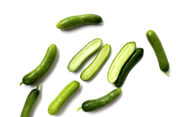 Fresh mini baby cucumbers on white background