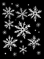 A pattern of white doodle snowflakes on a solid black background. This high-contrast winter design has a whimsical, festive look perfect for holiday and seasonal projects.