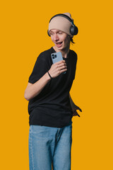 Bright young adult engaging with digital device and attire