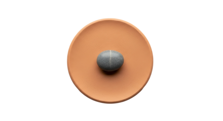 A single round grey stone sits perfectly centered in a rustic earthenware bowl, creating a serene and minimalist still life with earthy tones and textures