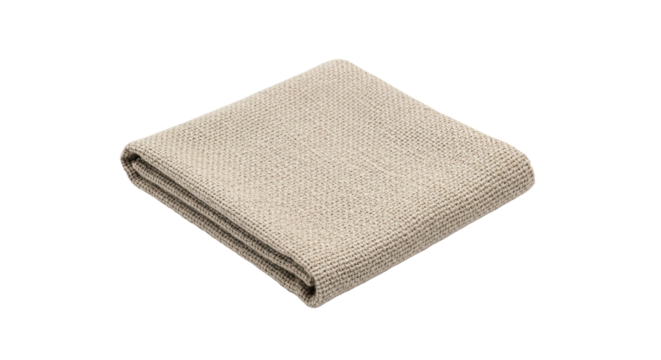 A soft and warm beige throw blanket made from a coarse woven textile is folded neatly, showcasing its intricate and detailed knitted pattern and comfortable material