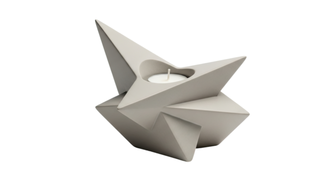 A modern gray star-shaped candle holder made of concrete with a small white tealight, featuring a minimalist geometric design with sharp angular facets and clean lines