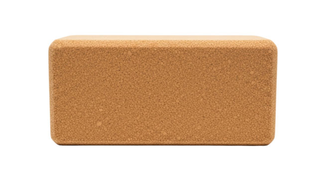 A rectangular eco-friendly cork yoga block with a natural granular texture and rounded edges, a sustainable prop for balance, stretching, and fitness exercises