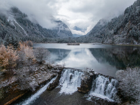 Misty Lake with Waterfall Outlet in winter - Powered by Adobe