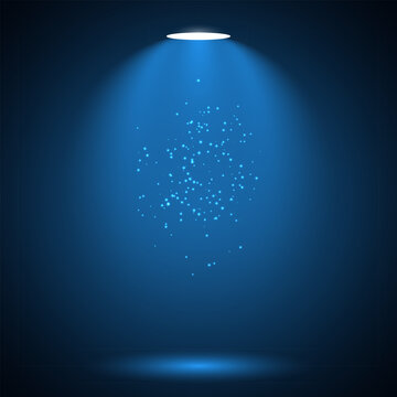 Abstract blue spotlight background illuminating a glittery dust cloud in center