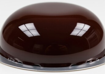 Glossy chocolate mirror glaze dessert close up, perfect for baking and confectionery