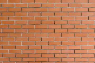 Obraz premium Orange brick wall texture with clean horizontal alignment, ideal for architectural backgrounds, construction themes, and interior design references.