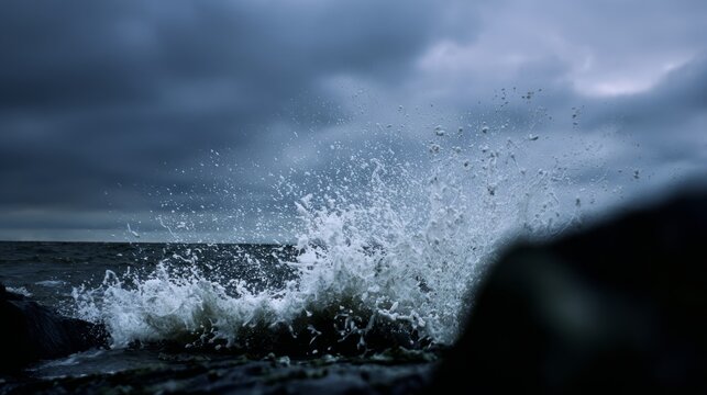 oligarchy. Ocean waves crashing against a dark rocky coastline with a stormy sky. travel magazines, destination branding, designed for outdoor magazines and nature guides.

