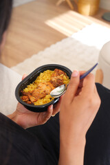 Enjoying a delicious meal with rice and chicken