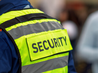 Security Personnel Wearing Reflective Vest in Action