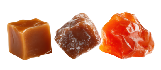 Three piles of caramel candy chocolate candy and jelly candy side by side on transparent background