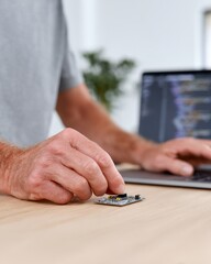 Fototapeta premium Man is typing on a laptop computer
