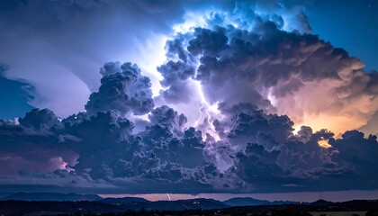 A dramatic nighttime image captures a massive cumulonimbus cloud illuminated by lightning, showcasing power, energy and scale