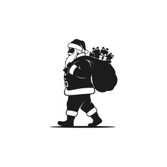 Silhouette of Santa Claus walking with a large sack full of presents on his back, ready for Christmas.